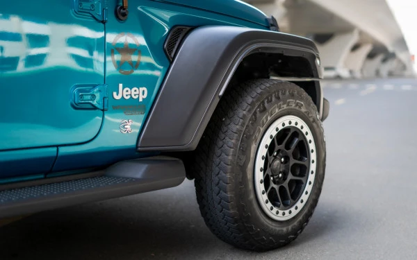 Blue Jeep Wrangler Limited Sport Edition convertible Photo 3