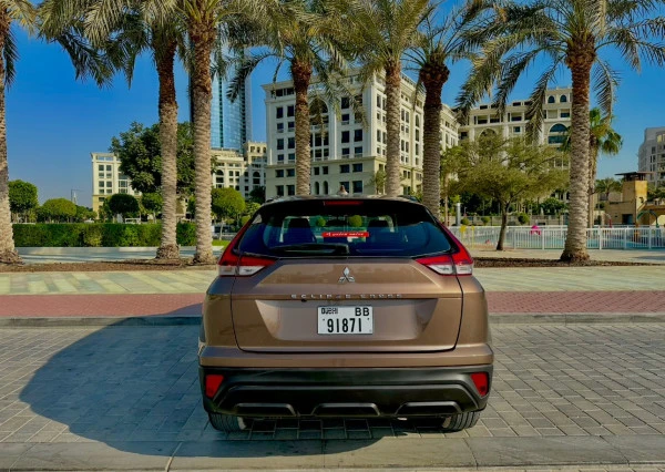 Brown Mitsubishi Eclipse Photo 2